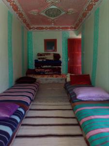 Postel nebo postele na pokoji v ubytování Gte Tawada - Haut-atlas - Room for 3 people