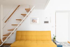A seating area at iFlat Yellow Monti Studio Apartment