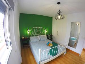 En eller flere senge i et værelse på Apartamento La Paella de Bajamar