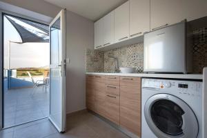 Kuchyň nebo kuchyňský kout v ubytování Tamaris Villa