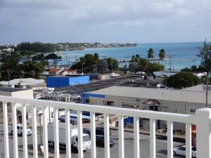 a view from a balcony of a parking lot at Oistins Bayview Apartments in Christ Church
