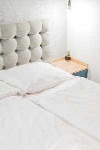 Posteľ alebo postele v izbe v ubytovaní ZEUS Design Apartments - Reumannplatz