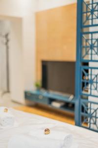 Televízia a/alebo spoločenská miestnosť v ubytovaní ZEUS Design Apartments - Reumannplatz