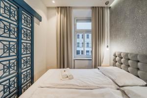 Posteľ alebo postele v izbe v ubytovaní ZEUS Design Apartments - Reumannplatz