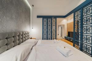 Posteľ alebo postele v izbe v ubytovaní ZEUS Design Apartments - Reumannplatz