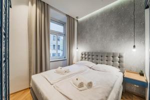 Posteľ alebo postele v izbe v ubytovaní ZEUS Design Apartments - Reumannplatz