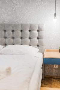 Posteľ alebo postele v izbe v ubytovaní ZEUS Design Apartments - Reumannplatz