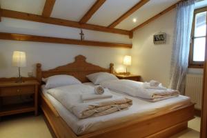 a bedroom with a bed with towels on it at Haus Staudach 1 by Apartment Managers in Kitzbühel