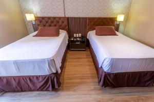 Postel nebo postele na pokoji v ubytování Hotel Village Premium Joao Pessoa