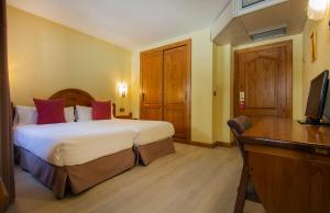 TV a/nebo společenská místnost v ubytování Hotel Sant Gothard