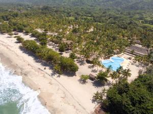 an aerial view of the beach at the resort at Tay Beach Hotel Tayrona in Buritaca
