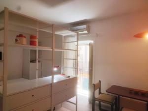 a room with a dresser and a desk and a chair at Casa AL CORSO Pozzuoli Centro in Pozzuoli