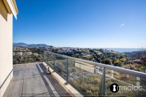 a view from the balcony of a house at Apartment with swimming pool and garage in a standing residence in Nice