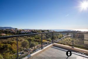 a view from the balcony of a house with the ocean at Apartment with swimming pool and garage in a standing residence in Nice