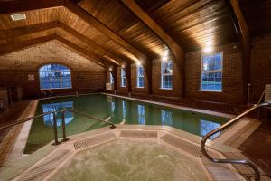 a large indoor swimming pool in a building at Dunadry Hotel And Gardens in Antrim