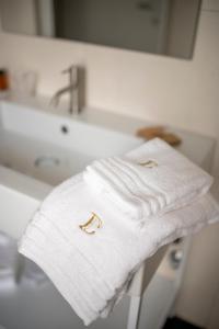 a white towel sitting on top of a bathroom counter at B&B il Divino in Naples