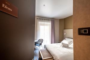 A bed or beds in a room at B&B il Divino