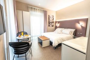 A bed or beds in a room at B&B il Divino
