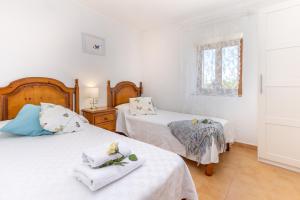 Posteľ alebo postele v izbe v ubytovaní Villa Lloquet By homevillas360 + 37 fotografií