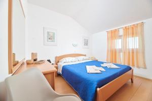 Кровать или кровати в номере Apartman Igor