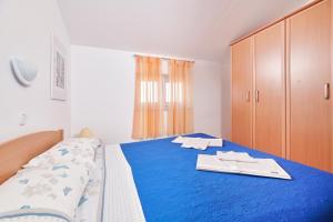 Кровать или кровати в номере Apartman Igor