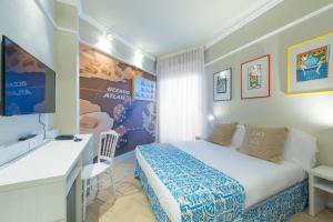 Postel nebo postele na pokoji v ubytování Admiral Art Hotel