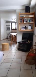 a living room with a couch and a table at Chez Laurette et Louis in Ugine