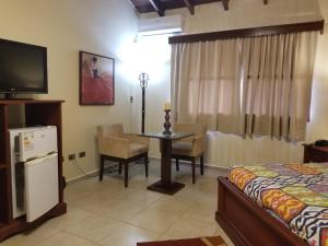 Televisyen dan/atau pusat hiburan di Apart-Hotel San Ignacio-Boutique 5 Estrellas