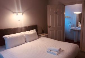 Posteľ alebo postele v izbe v ubytovaní Atlantic Hotel