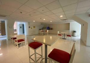 a large room with a table and chairs in it at Hotel MX forum buenavista CDMX, Trademark by Wyndham in Mexico City