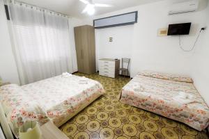 Postel nebo postele na pokoji v ubytování Sea Salento Casa Vacanze