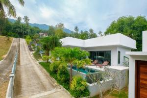 a house with a road leading up to it at T villas in Thong Nai Pan Yai