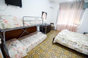 Postel nebo postele na pokoji v ubytování Sea Salento Casa Vacanze