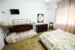 Postel nebo postele na pokoji v ubytování Sea Salento Casa Vacanze