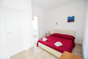 Postel nebo postele na pokoji v ubytování Sea Salento Casa Vacanze