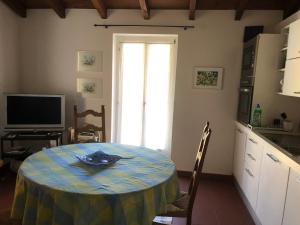 a kitchen with a table with a plate on it at Cà di Nani in Solduno