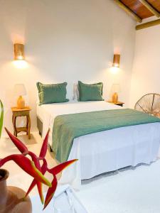 Giường trong phòng chung tại Pousada Villa dos Corais