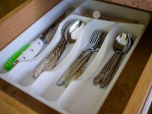 a plastic tray with utensils on a table at Апартаменти по вул Галицька in Ivano-Frankivsʼk