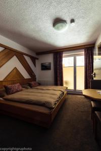 Ένα ή περισσότερα κρεβάτια σε δωμάτιο στο Haus Stockibach