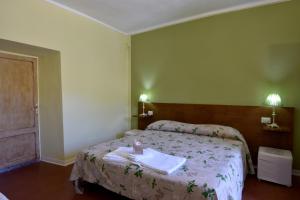 A bed or beds in a room at Agriturismo Mulin Del Rancone