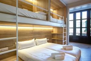 A bed or beds in a room at Weflating City Center