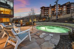 The swimming pool at or close to Luxurious & Modern Ski-in, Ski-out 2 BR in Canyons Village condo