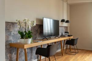 TV o dispositivi per l'intrattenimento presso Hotel Leopardi