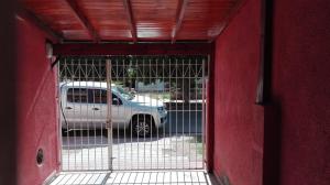 a car parked in a parking lot behind a gate at DEPARTAMENTO CON COCHERA in La Rioja