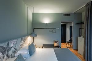 Letto o letti in una camera di Hotel Leopardi