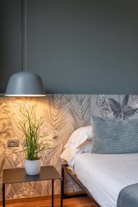 Letto o letti in una camera di Hotel Leopardi