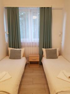 Postel nebo postele na pokoji v ubytování Hostel Mleczna - Metro Zacisze