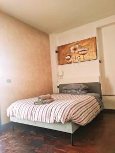 Postel nebo postele na pokoji v ubytování B&B La Tartaruga