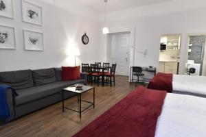 a living room with a couch and a table at Apartment Callisto in Zagreb