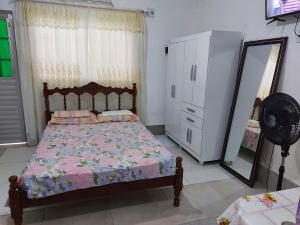 Giường trong phòng chung tại Casa para temporada